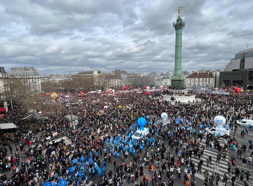 Protestors gather on place de la Bastille to attend a demonstration a week after the government pushed a pensions reform through parliament without a vote, using the article 49.3 of the constitution, in Pari (AFP via Getty Images)