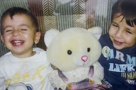 A close up shows Aylan Kurdi (L) and his brother Galip in an undated Kurdi family photograph placed outside the home of their aunt Tima Kurdi in Coquitlam, British Columbia September 3, 2015. REUTERS/Kurdi family/Handout via Reuters