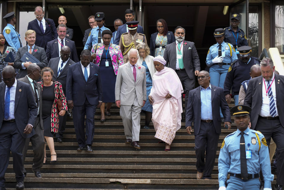 Britain's King Charles III, centre, walks with Under-Secretary-General of the United Nations, Zainab Hawa Bangura, during a visit to the United Nations Office, in Nairobi, Kenya Wednesday, Nov. 1, 2023. (AP Photo/Brian Inganga, Pool)