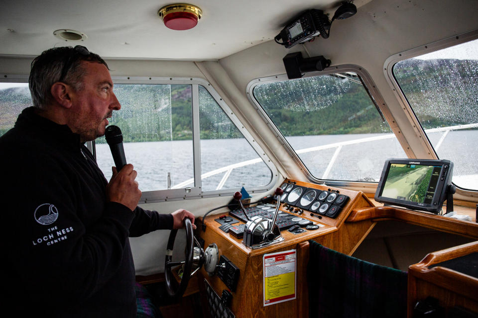 The pilot of the Loch Ness Project Research Vessel. tells visitors about the technologies that have been used in the past to search for the monster. (Emily Macinnes for NBC News)