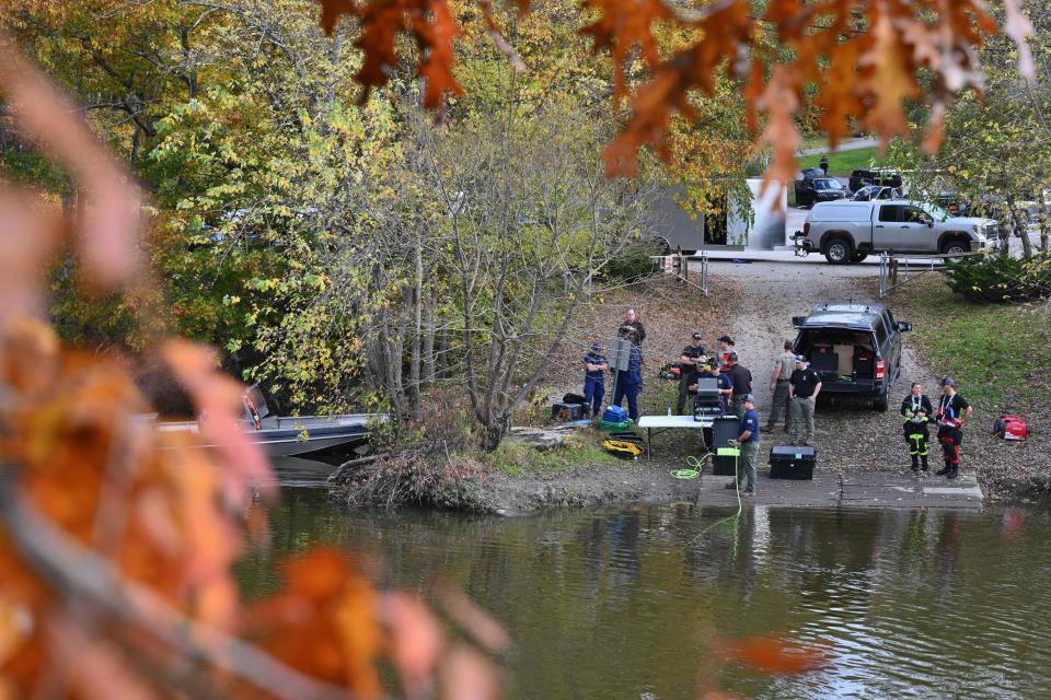 Law enforcement officials prepare to search the Androscoggin River in Lisbon Falls, Maine (AFP via Getty Images)