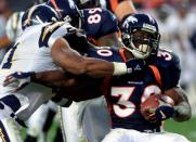 FILE PHOTO: BRONCOS DAVIS STIFF ARMS SAN DIEGO DEFENDER.