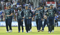 England players leave the pitch at the end of play as they lose the third one day international cricket match between England and India at Emirates Old Trafford cricket ground in Manchester, England, Sunday, July 17, 2022. (AP Photo/Rui Vieira)