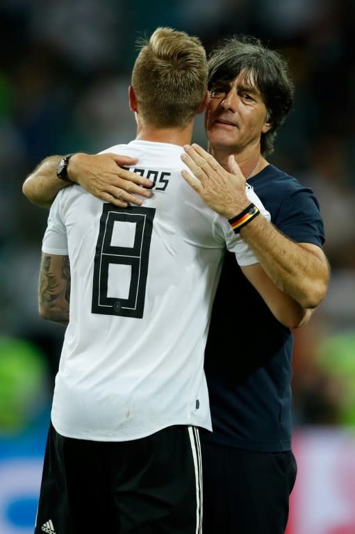 Toni Kroos and Germany coach Joachim Loew embrace at the end of Saturday's game