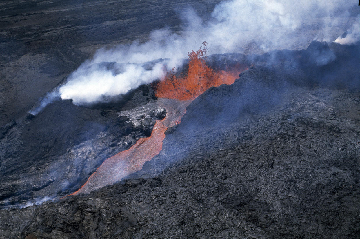 Molten rock flows from Mauna Loa, located on the south-central part of the island of Hawaii, on April 4, 1984. (AP)