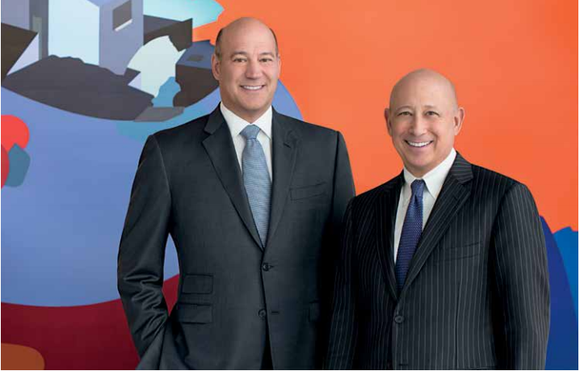 Goldman Sachs former President Gary Cohn standing with current chairman and CEO Lloyd Blankfein.