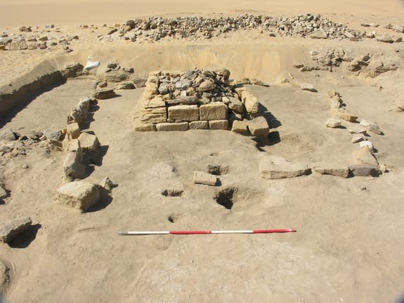 Beneath this pyramid in Sudan, archaeologists found a burial chamber holding the skeletal remains of three young children, buried with faience beads.