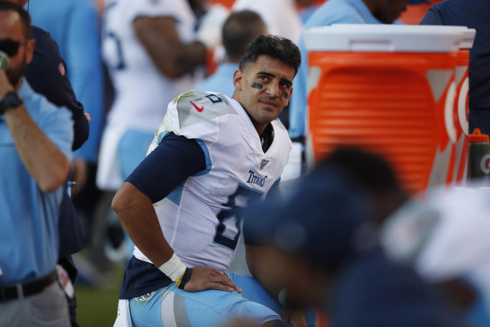 Tennessee Titans quarterback Marcus Mariota looks on from the sideline during the second half of an NFL football game against the Denver Broncos, Sunday, Oct. 13, 2019, in Denver. (AP Photo/David Zalubowski)