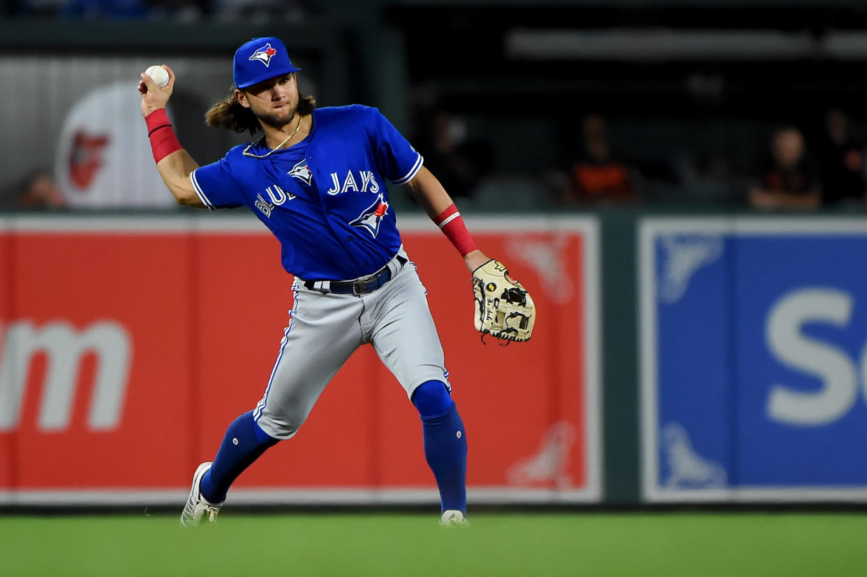 BALTIMORE, MD - AUGUST 02: Bo Bichette #11 of the Toronto Blue Jays throws to first base during the game against the Baltimore Orioles at Oriole Park at Camden Yards on August 2, 2019 in Baltimore, Maryland. (Photo by Will Newton/Getty Images)