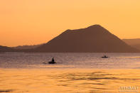 Sunset on Taal Lake. Most people see Taal Volcano from Tagaytay City in Cavite, a popular tourist destination. (Yen Baet)