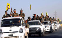 <p>Fighters of Syrian Democratic Forces ride on trucks as their convoy passes in Ain Issa, Syria, Oct. 16, 2017. (Photo: Erik De Castro/Reuters) </p>