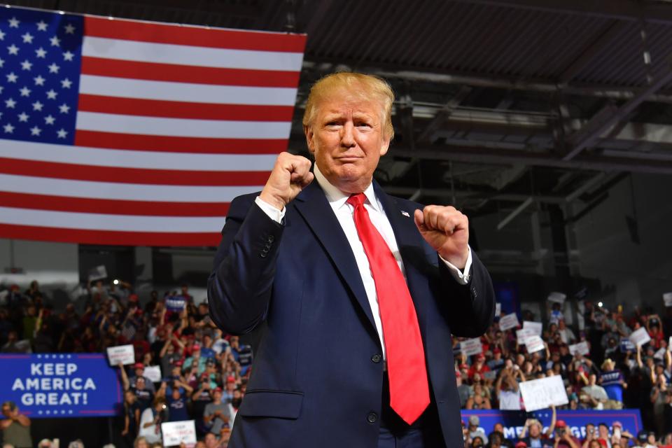 President Donald Trump pumps his fists as he arrives for a "Make America Great Again" rally at Minges Coliseum in Greenville, North Carolina, on July 17, 2019. (Photo: Nicholas Kamm/AFP/Getty Images)