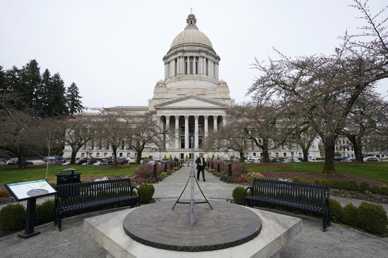 The sun dial near the Legislative Building is shown under cloudy skies at the state Capitol in Olympia, Wash.  (AP Photo/Ted S. Warren)