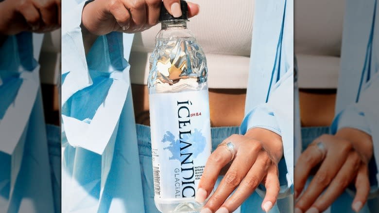 Woman holding bottle of water 