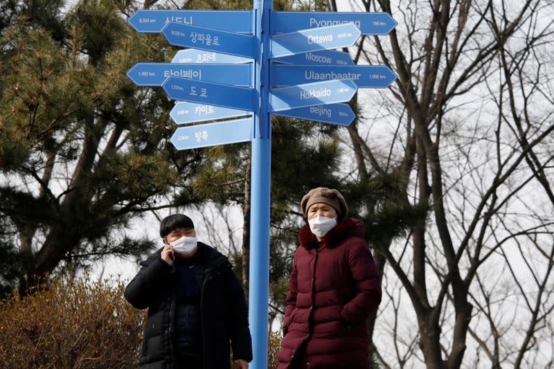 People wear masks to prevent contracting a new coronavirus near "N Seoul Tower" in Seoul