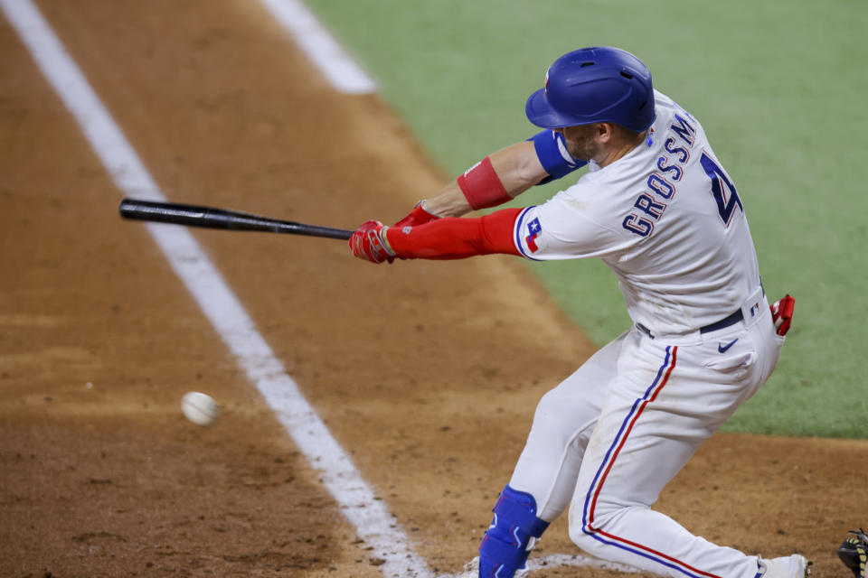 Texas Rangers' Robbie Grossman strikes out during the fifth inning of a baseball game against the Los Angeles Angels, Tuesday, June 13, 2023, in Arlington, Texas. (AP Photo/Gareth Patterson)