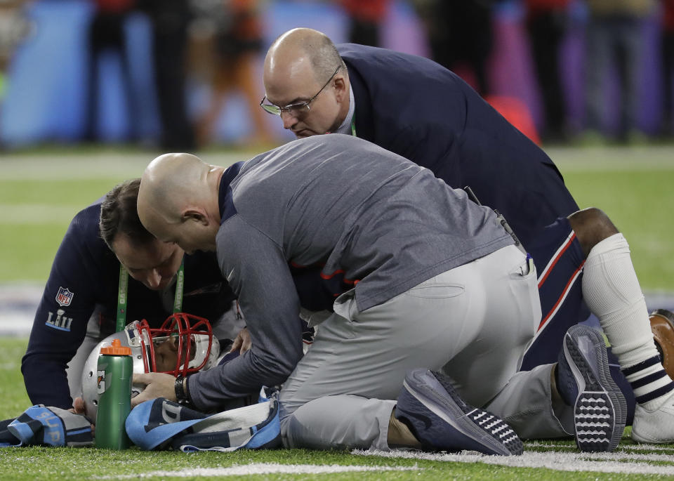 New England Patriots’ Brandin Cooks is tended to after being hit during the first half of the NFL Super Bowl LII. (AP Photo/Mark Humphrey)