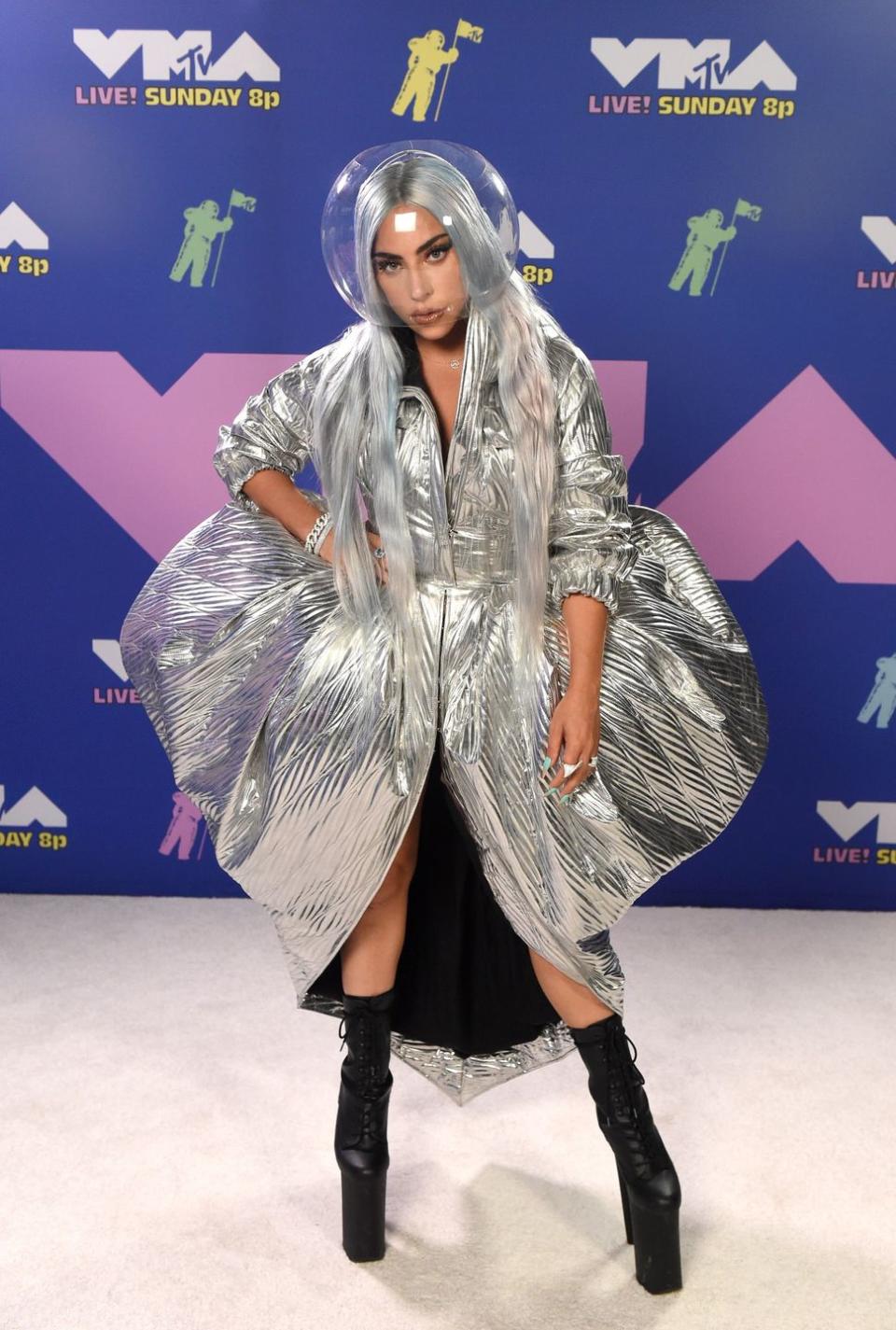 <p>Lady Gaga walked the red carpet in a futuristic silver dress, platform boots and a bubble visor - commenting on Instagram that she was "wearing face shields before it was a thing". </p>