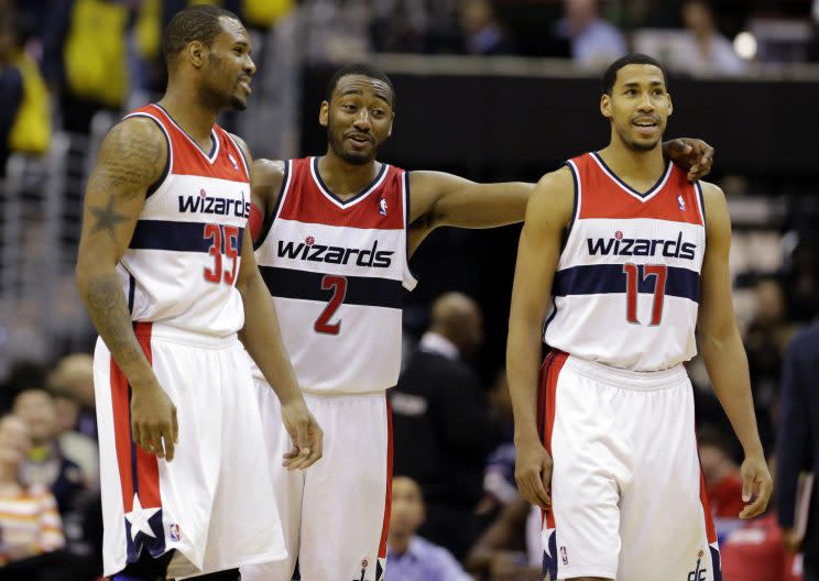 John Wall (2) may be regretting the day the Wizards parted ways with Trevor Booker (left) and Garrett Temple. (AP)