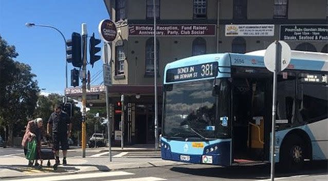 A kind Sydney bus driver helps an elderly lady cross the road. Source: Facebook.