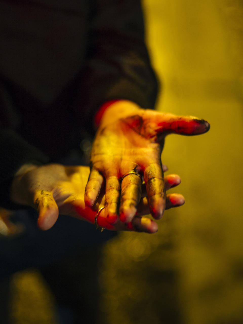 Lea, 22, a fashion student from Angouleme has her hands covered in paint after repairing a damaged slogan in Paris. France, a country that has prided itself on gender equality, is beginning to pay serious attention to its yet-intractable problem of domestic violence. This year alone, at least 130 women have been killed by their current or former partners, anti-domestic violence groups say. Activists have pasted signs all over Paris to pressure authorities to do more to help victims, whom they say law enforcement too often fail to protect. (Photo: Kamil Zihnioglu/AP)