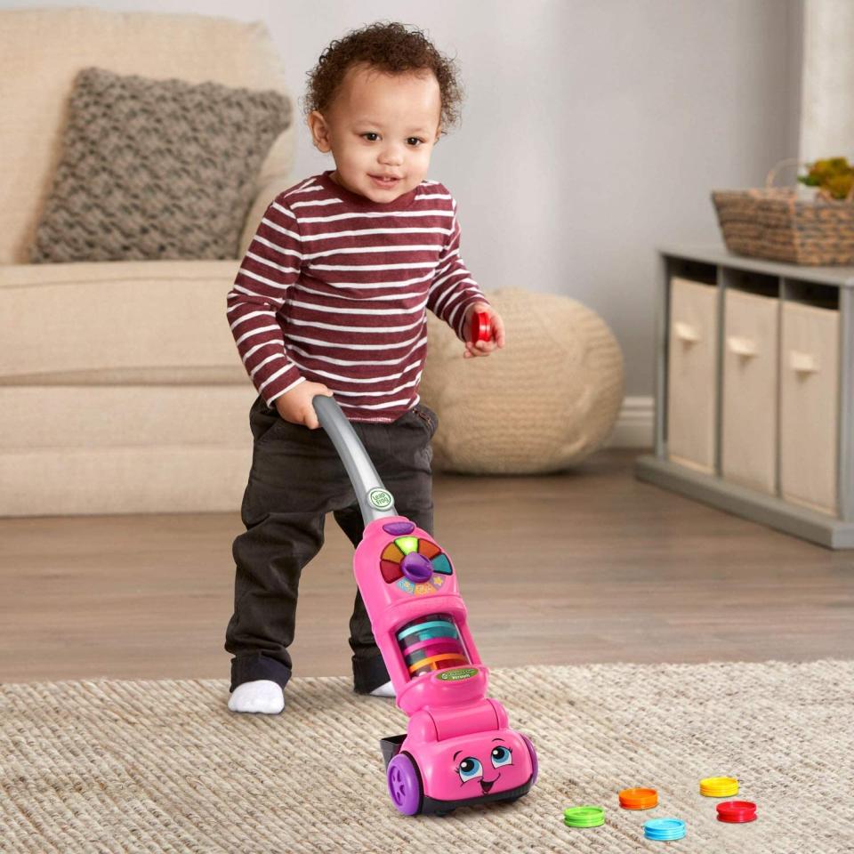 Teach your toddler to pick up after themself while making it seem like fun with this toy that lights up and has bouncing balls in it. (It does require four <a href="https://amzn.to/3dDAbTr" target="_blank" rel="noopener noreferrer">AA batteries</a>.)<br /><br /><strong>Promising review:</strong> "I bought it for my son's birthday. So far so good. He obsessed with the vacuum cleaner. This one seems to capture his attention!" &mdash; <a href="https://amzn.to/3gDdIYN" target="_blank" rel="noopener noreferrer">Miss t</a>﻿<br /><strong><br />Get it from Amazon for <a href="https://amzn.to/3gDdIYN" target="_blank" rel="noopener noreferrer">$27.49</a> (available in two colors).</strong>