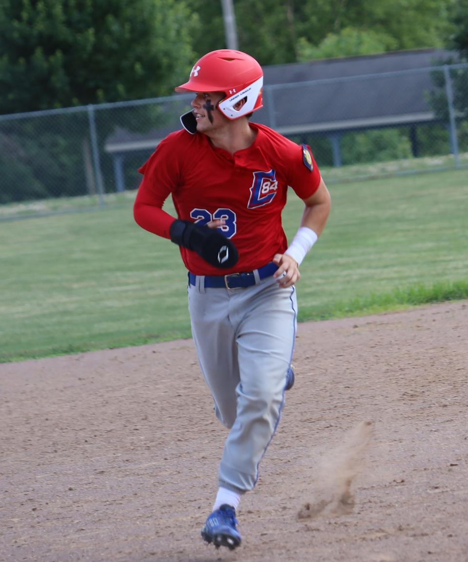 Cambridge Post 84's Gates Thompson (23) runs the bases  during Saturday's game with Meigs County in Don Coss Invitational action at Don Coss Stadium.