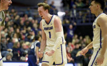 Portland forward Moses Wood reacts after hitting a shot during the first half of an NCAA college basketball game against the Gonzaga in Portland, Ore., Saturday, Jan. 28, 2023. (AP Photo/Steve Dykes)