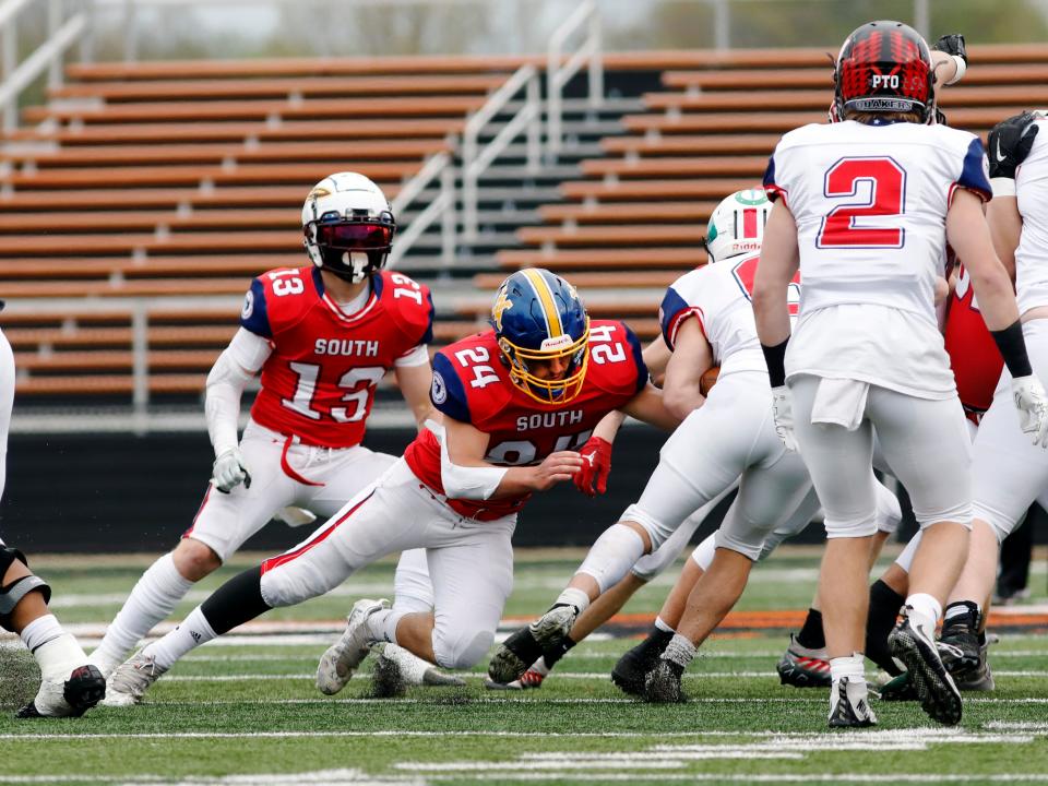 West Muskingum linebacker Ty Shawger makes a tackle during the second quarter of the South's 27-18 loss to the North in the Division IV-VIII game at the Ohio North-South Football Classic on Saturday at Paul Brown Stadium in Massillon.