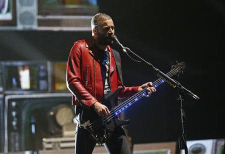 Bassist Chris Wolstenholme of Muse performs at the Coachella Valley Music and Arts Festival in Indio