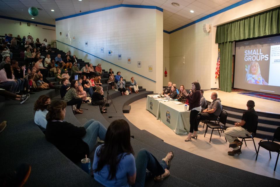 At a March 14 meeting, Asheville City Schools Superintendent Maggie Fehrman presented an updated construction plan to assembled parents on the tiered risers of the school's planetarium.