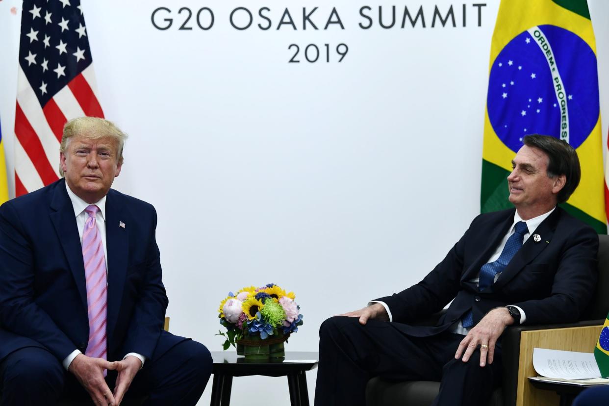 Brazil's President Jair Bolsonaro (R) meets with US President Donald Trump during a bilateral meeting on the sidelines of the G20 Summit in Osaka on June 28, 2019. (Photo by Brendan Smialowski / AFP) (Photo credit should read BRENDAN SMIALOWSKI/AFP via Getty Images)