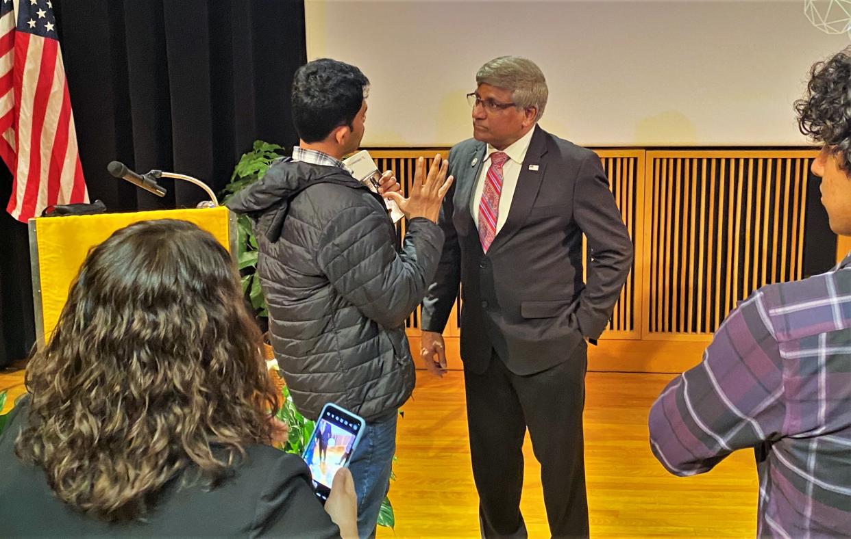 National Science Foundation director Sethuraman Panchanathan visits with MU assistant research professor Abilash Gangula on Monday after the director's talk at the University of Missouri.