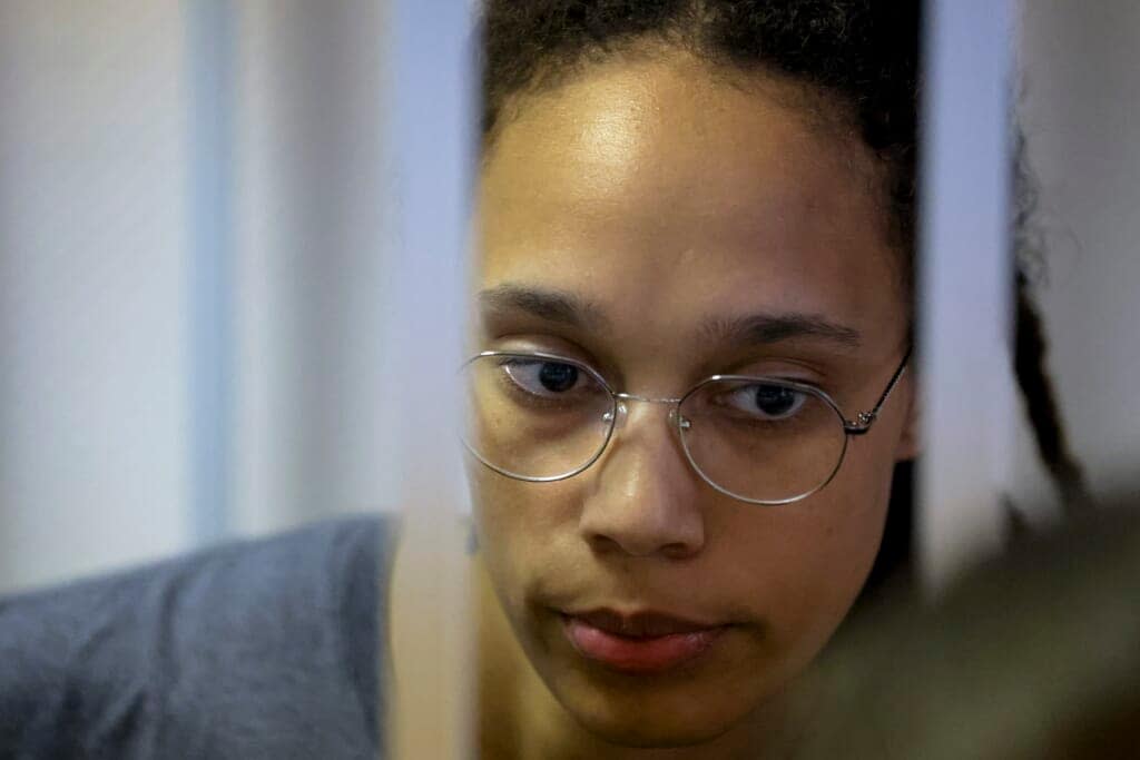 WNBA star and two-time Olympic gold medalist Brittney Griner stands in a cage in a courtroom prior to a hearing in Khimki just outside Moscow, Russia, Thursday, Aug. 4, 2022. (Evgenia Novozhenina/Pool Photo via AP)