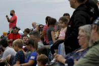 Spectators watch from Titusville, Fla. as SpaceX Falcon 9 prepares to lift off with NASA astronauts Doug Hurley and Bob Behnken in the Dragon crew capsule, Wednesday, May 27, 2020 from the Kennedy Space Center at Cape Canaveral, Fla. The launch of the SpaceX test flight to the International Space Station was scrubbed with more than 16 minutes to go in the countdown due to lightning. (AP Photo/Charlie Riedel)