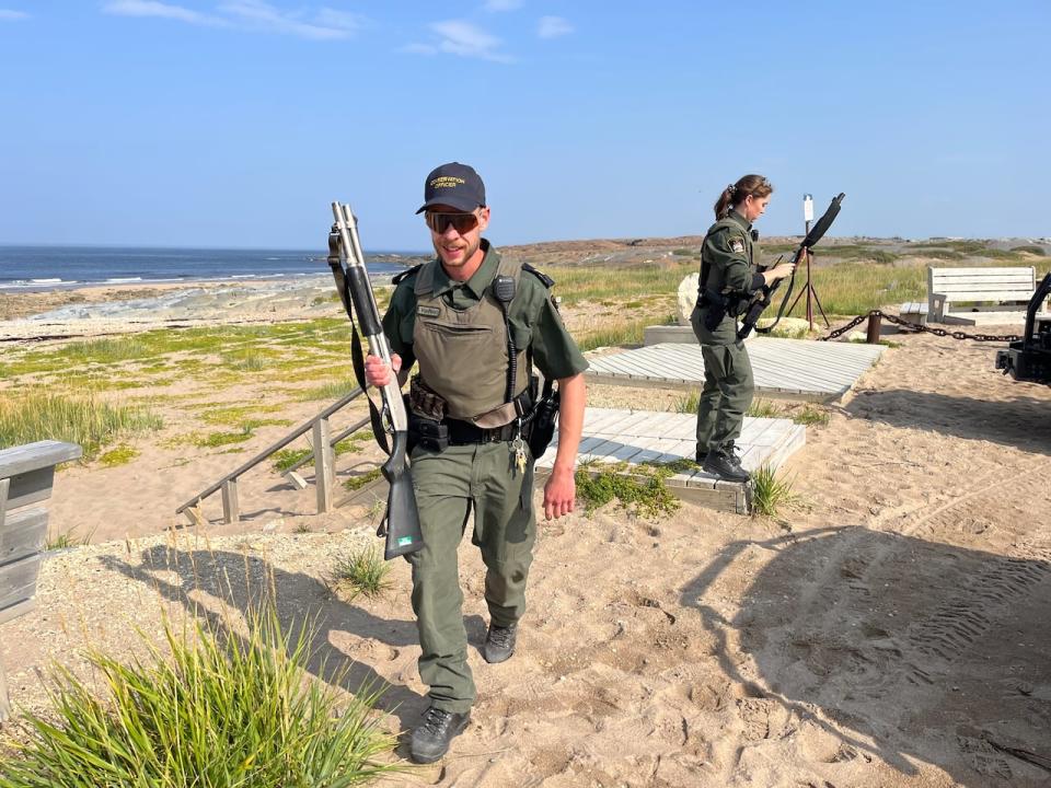 Conservation officers Ian Van Nest and Chantal Maclean return from checking out the beach behind Churchill's municipal complex for a report of polar bear wandering into town. They did not find a bear. At the same time, seven were reported near the shore of Hudson Bay slightly east of the town.