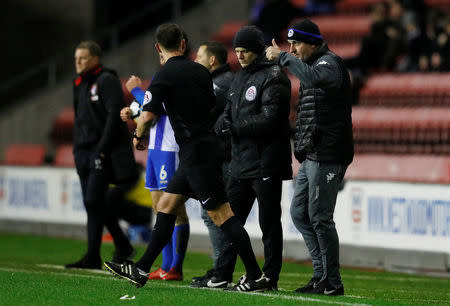 Soccer Football - FA Cup Third Round Replay - Wigan Athletic vs AFC Bournemouth - DW Stadium, Wigan, Britain - January 17, 2018 Wigan Athletic manager Paul Cook and referee Stuart Attwell REUTERS/Phil Noble