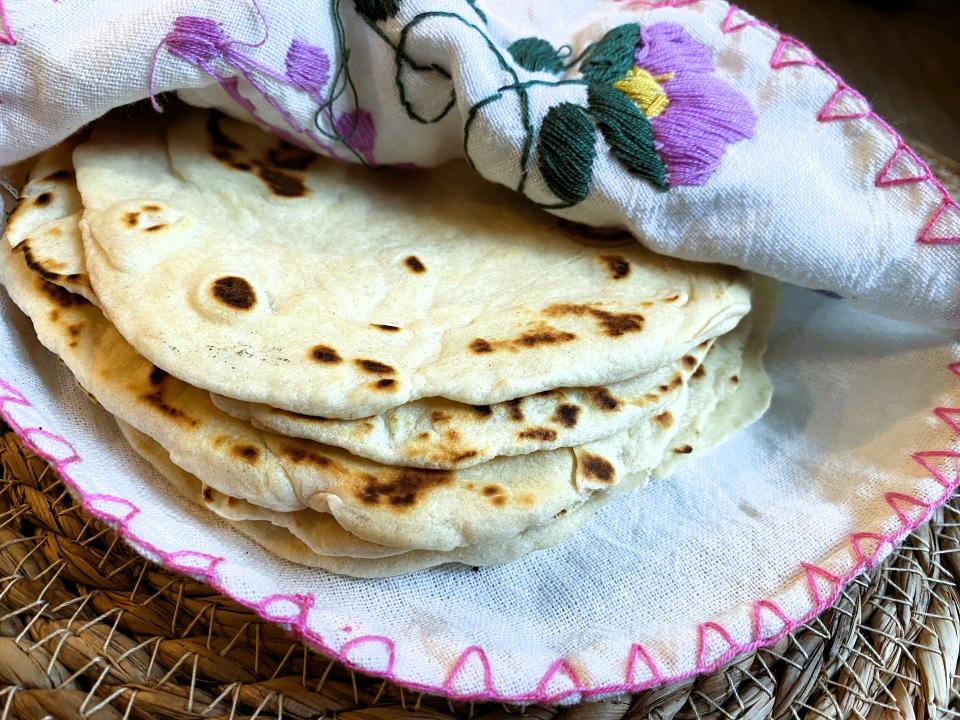 Flour tortillas are used to make burritos and are an option to use for soft tacos. The author's family enjoys them rolled up to eat with just about any warm bowl of soup or chili.