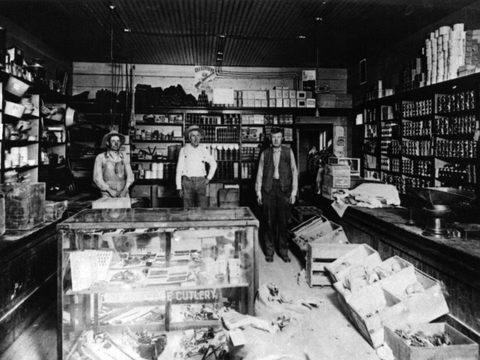 Three men in a store in 1910 in Las Vegas.