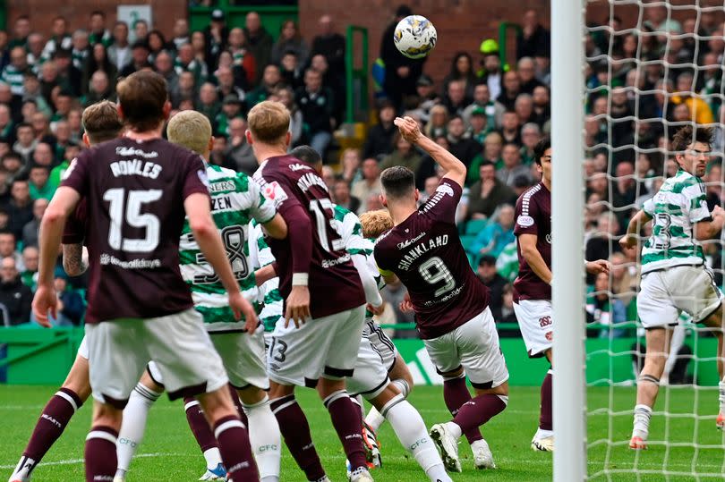 Hearts' Lawrence Shankland is penalised for a handball