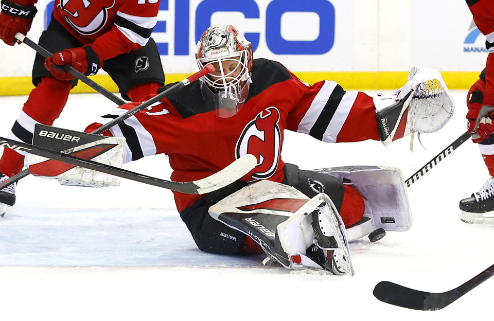 New Jersey Devils goaltender Vitek Vanecek (41) makes a save against the Colorado Avalanche during the first period of an NHL hockey game Tuesday, Feb. 6, 2024, in Newark, N.J. (AP Photo/Noah K. Murray)