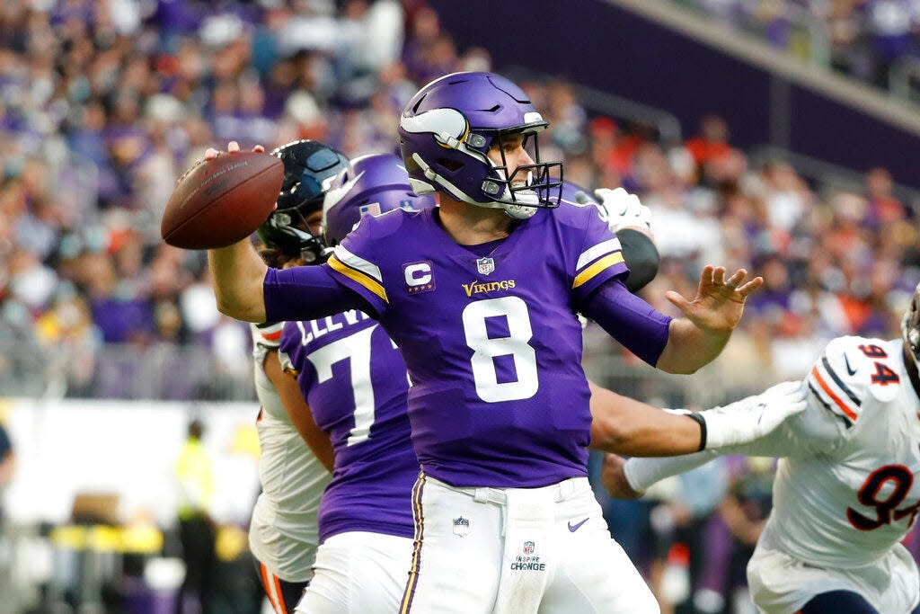 Minnesota Vikings quarterback Kirk Cousins (8) throws a pass during the second half of an NFL football game against the Chicago Bears, Sunday, Jan. 9, 2022, in Minneapolis. (AP Photo/Bruce Kluckhohn)