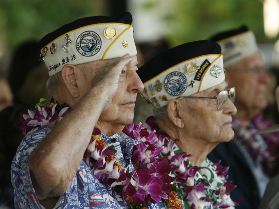 USS Arizona survivor Louis Conter salutes during the "Moment of Silence" during the 72nd anniversary of the attack on Pearl Harbor at the WW II Valor in the Pacific National Monument in Honolulu, Hawaii on December 7, 2013. (REUTERS/Hugh Gentry)