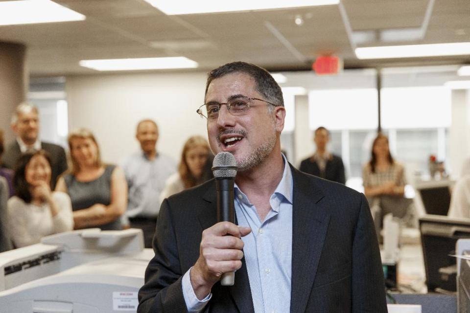 After the Pulitzer Prize for Public Service was awarded to The Washington Post, reporters and editors gather in the newsroom in Washington, Monday, April 14, 2014, as contributing writer Barton Gellman describes the effort that went into a series of stories on the government’s massive surveillance program based on information leaked by National Security Agency employee Edward Snowden. The disclosures showed that the NSA has collected information about millions of Americans’ phone calls and emails based on its classified interpretations of laws passed after the 2001 terrorist attacks. The Pulitzer Prizes, journalism’s highest honor, are given out each year by Columbia University on the recommendation of a board of journalists and others. This is Gellman’s third Pulitzer honor. (AP Photo/J. Scott Applewhite)