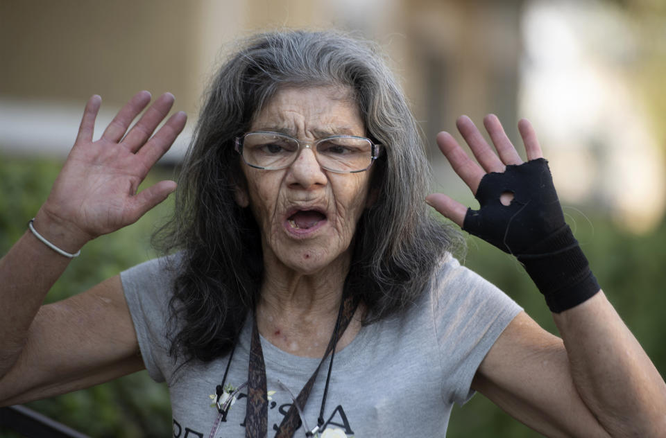 "I'm the master of assassination," Lorenza Marrujo, 67, says when asked about her martial arts skills at her Fontana, Calif., apartment home Wednesday, Sept. 30, 2020. Marrujo, who likes to be called “Lady Ninja” and has a black belt in ju jitsu, said she was in her third-floor apartment Monday when she heard screams coming from a neighbor's apartment and went to investigate. There, she said, she found another neighbor attacking her 87-year-old friend, Elizabeth McCray. Marrujo came to her rescue. (Cindy Yamanaka/The Orange County Register/SCNG via AP)