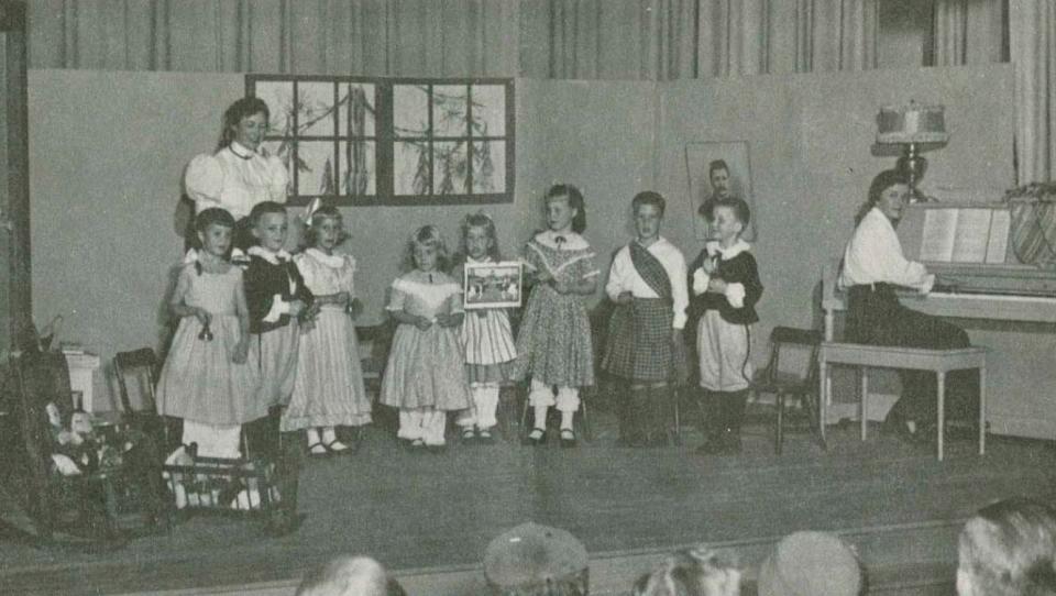 Kindergarten centennial skit put on by Masquers theater mothers at Andrew Jackson school in May 1956. Teachers: Mrs. Bert Beduhn, Mrs. Sylvester Ferguson. Pupils: Wendy Beduhn, Peter Callahan, Jean Ferguson, Anne Savage, Lynn Touhey, Ann Ziebel, Chip Bouril and Kalley Callahan.