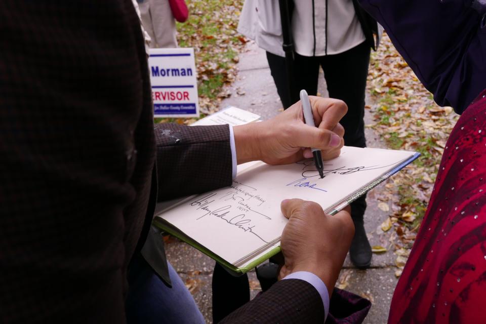 Cory Booker signs an autograph at an event in Adel, Iowa, on Oct. 8. (Photo: Hunter Walker/Yahoo News)