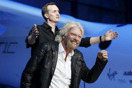 Richard Branson (R) and Virgin Galactic CEO George Whitesides unveil the new SpaceShipTwo, a six-passenger two-pilot vehicle meant to ferry people into space that replaces a rocket destroyed during a test flight in October 2014, in Mojave, California, United States, February 19, 2016. REUTERS/Lucy Nicholson