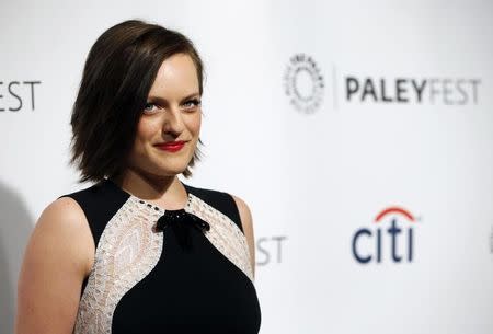 Cast member Elisabeth Moss poses as she arrives for a panel discussion for the television series "Mad Men" during the The William S. Paley Television Festival at the Dolby theatre in Hollywood, California March 21, 2014. REUTERS/Mario Anzuoni