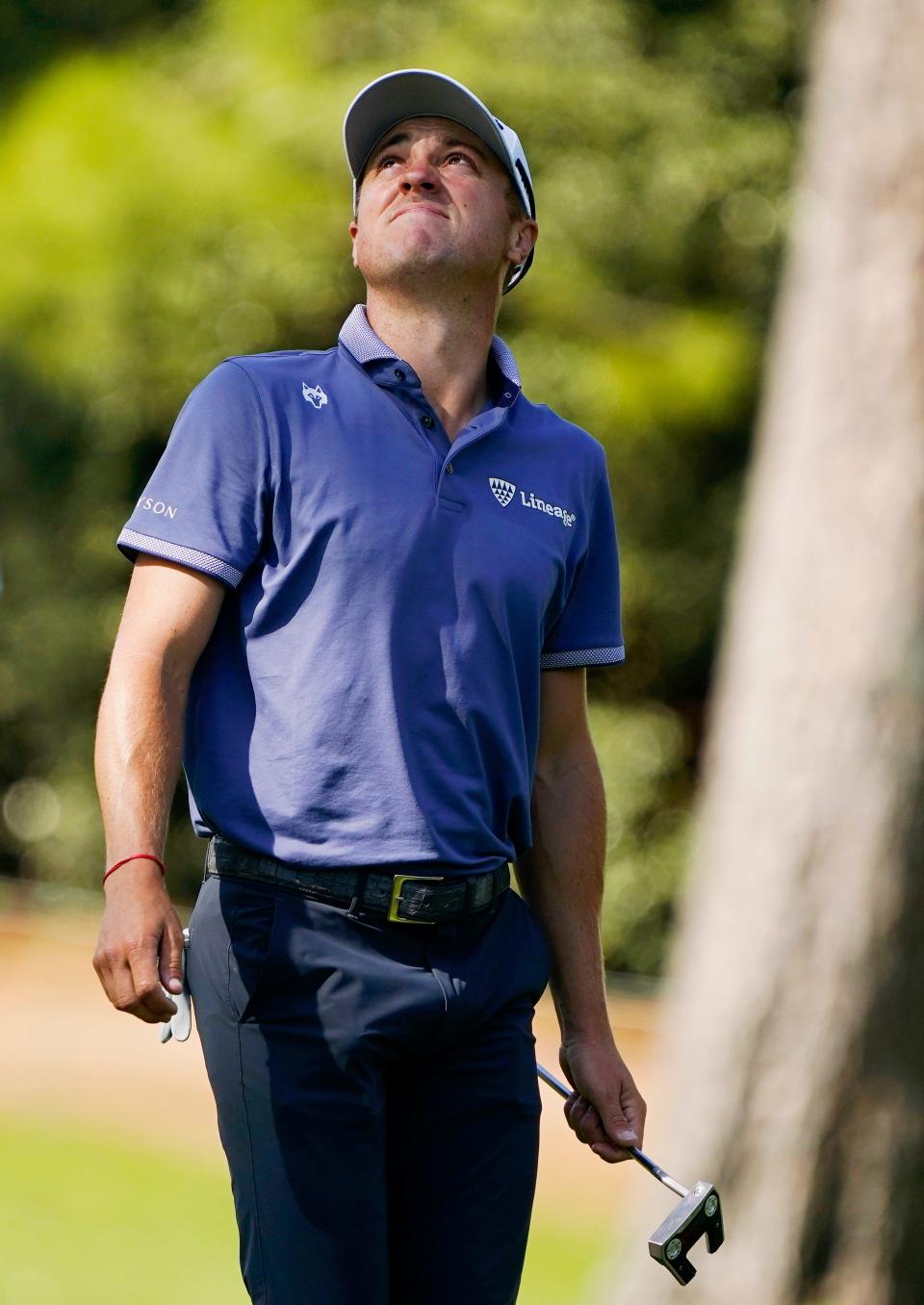 Apr 12, 2024; Augusta, Georgia, USA; Justin Thomas looks at the trees on No. 10 after some pinecones fell during the second round of the Masters Tournament. Mandatory Credit: Katie Goodale-USA TODAY Network